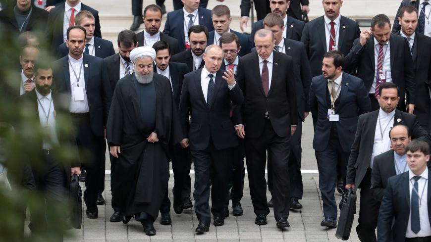 Iranian President Hassan Rouhani, Russian President Vladimir Putin and Turkish President Recep Tayyip Erdogan walk during their meeting in the Black sea resort of Sochi, Russia, 14 February 2019. Sergei Chirikov/Pool via REUTERS - RC1506773F00