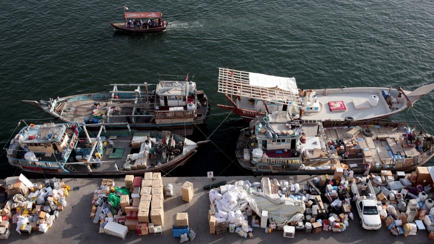 Goods wait to be loaded on dhows bound for Iran along the creek in old Dubai, United Arab Emirates November 5, 2018. Picture taken November 5, 2018. REUTERS/Christopher Pike - RC1B41189A80