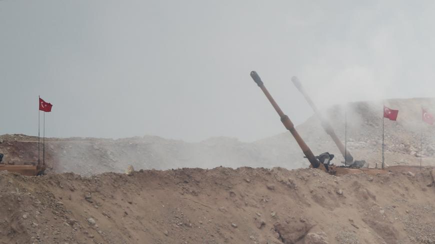 A Turkish army howitzer fires from a military post on the Turkish-Syrian border in Hatay province, Turkey February 26, 2018. REUTERS/Umit Bektas - RC1DA3686FA0
