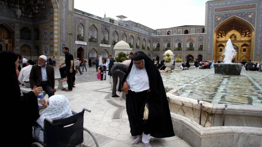 Iranian pilgrims visit the Shiite Muslim shrine of Imam Reza in the holy city of Mashhad, 900 kms northeast of Tehran, on May 31, 2009. AFP PHOTO/ATTA KENARE (Photo credit should read ATTA KENARE/AFP/Getty Images)