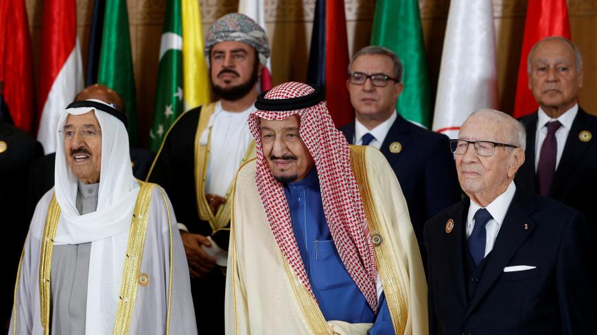 Tunisian President Beji Caid Essebsi stands with Saudi Arabia's King Salman bin Abdulaziz and Emir of Kuwait Sabah Al-Ahmad Al-Jaber Al-Sabah during the group photo with Arab leaders, ahead of the 30th Arab Summit in Tunis, Tunisia March 31, 2019. REUTERS/Zoubeir Souissi/Pool - RC17FA0F57C0