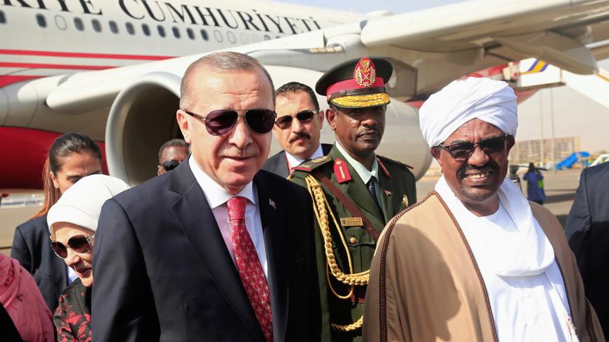Sudanís President Omar al-Bashir welcomes Turkey's†President†Tayyip Erdogan at Khartoum Airport, Sudan December 24, 2017. REUTERS/Mohamed Nureldin Abdallah     TPX IMAGES OF THE DAY - RC1F19ED0F80