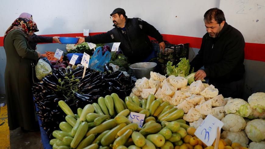 People shop at a food market in Istanbul, Turkey, February 11, 2019. REUTERS/Murad Sezer - RC1FDE55C390
