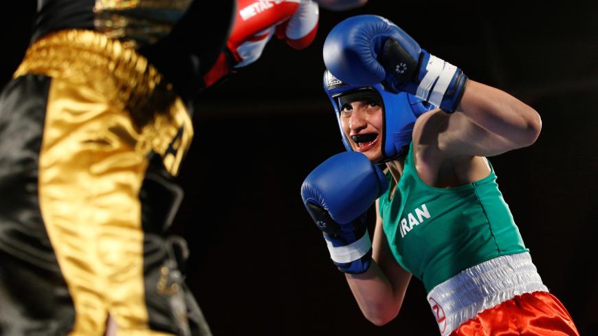 Iranian boxer Sadaf Khadem in action against French boxer Anne Chauvin during an official boxing bout in Royan, France, April 13, 2019. REUTERS/Stephane Mahe     TPX IMAGES OF THE DAY - RC131CD9CE10