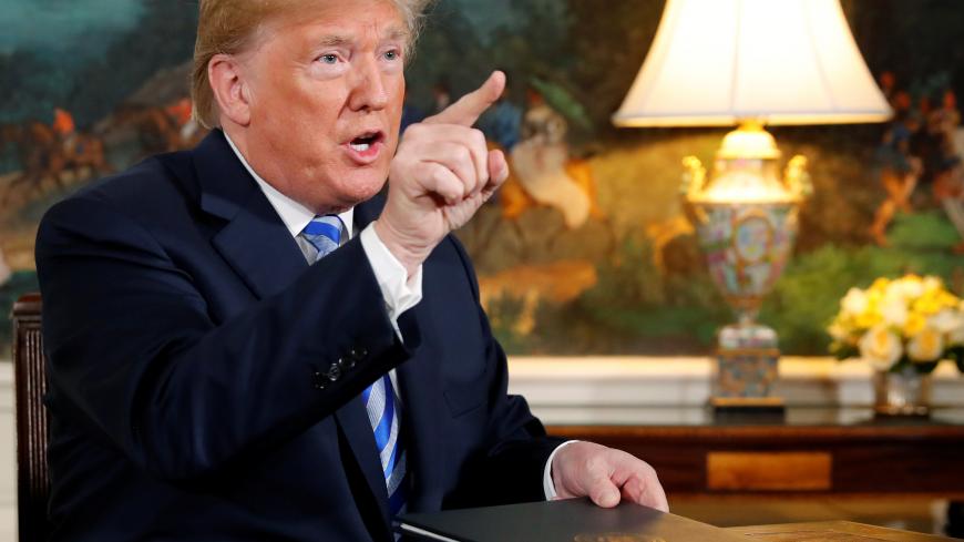 U.S. President Donald Trump speaks to reporters after signing a proclamation declaring his intention to withdraw from the JCPOA Iran nuclear agreement in the Diplomatic Room at the White House in Washington, U.S. May 8, 2018.  REUTERS/Jonathan Ernst - RC1DA5C1CB70