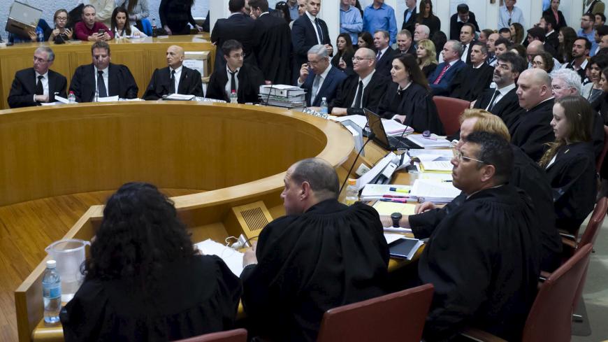 Israeli Prime minister Bejamin Netanyahu sits in the Supreme Court before he speaks at a hearing about the legality of a government-approved deal to develop Israel's offshore natural gas reserves in Jerusalem, February 14, 2016. REUTERS/ Jim Hollander/ POOL - GF10000308252