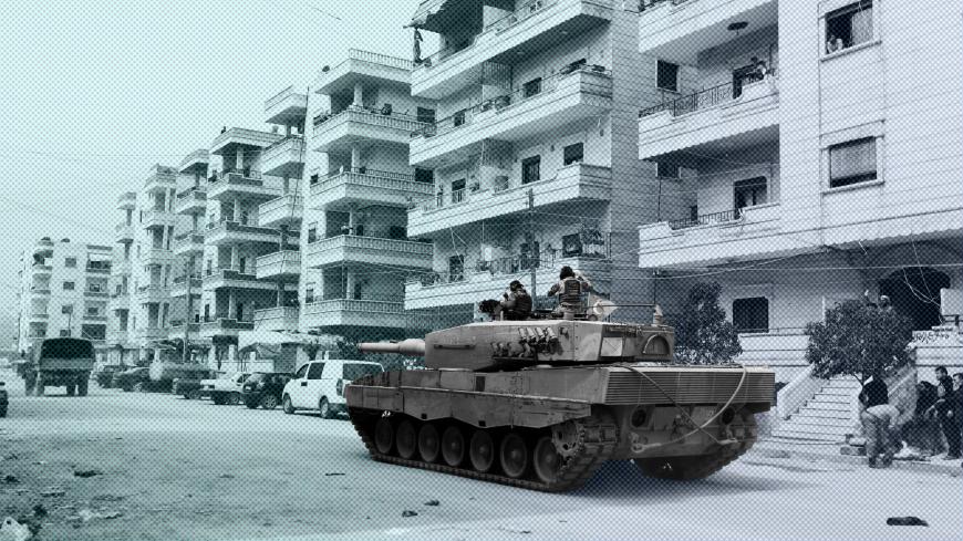 Turkish soldiers ride on a military vehicle in the center of Afrin, Syria March 24, 2018. REUTERS/Khalil Ashawi - RC1B6933DB00