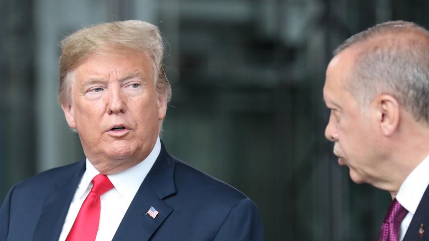 U.S. President Donald Trump talks to Turkey’s President Recep Tayyip Erdogan at NATO headquarters in Brussels, Belgium July 11, 2018. Tatyana Zenkovich/Pool via REUTERS - RC1B9A3C2D00