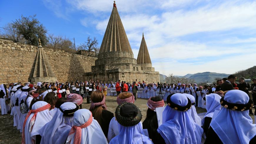 Yazidi's women attend a ceremony at Lilash Temple to commemorate the death of women who were killed by Islamic State militants, during the International Women Day, in Shikhan north of Iraq March 8, 2019. REUTERS/Ari Jalal - RC119D479580