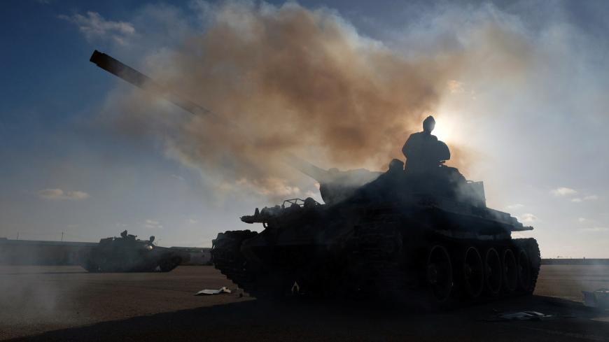 Members of Libyan National Army (LNA) commanded by Khalifa Haftar, get ready before heading out of Benghazi to reinforce the troops advancing to Tripoli, in Benghazi, Libya April 13, 2019. REUTERS/Esam Omran Al-Fetori - RC1B9C0FEEB0