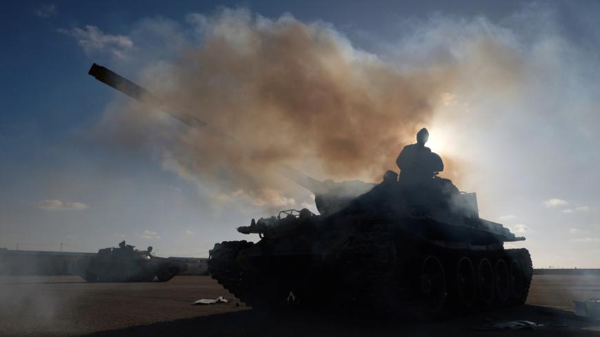Members of Libyan National Army (LNA) commanded by Khalifa Haftar, get ready before heading out of Benghazi to reinforce the troops advancing to Tripoli, in Benghazi, Libya April 13, 2019. REUTERS/Esam Omran Al-Fetori - RC1B9C0FEEB0