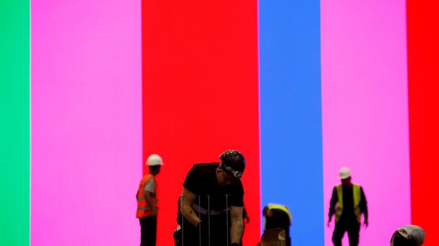 Labourers work on the construction of the stage and setting where this year's Eurovision Song Contest shows will be hosted at the Expo Tel Aviv, Israel April 15, 2019. REUTERS/Amir Cohen      TPX IMAGES OF THE DAY - RC177BA01C00