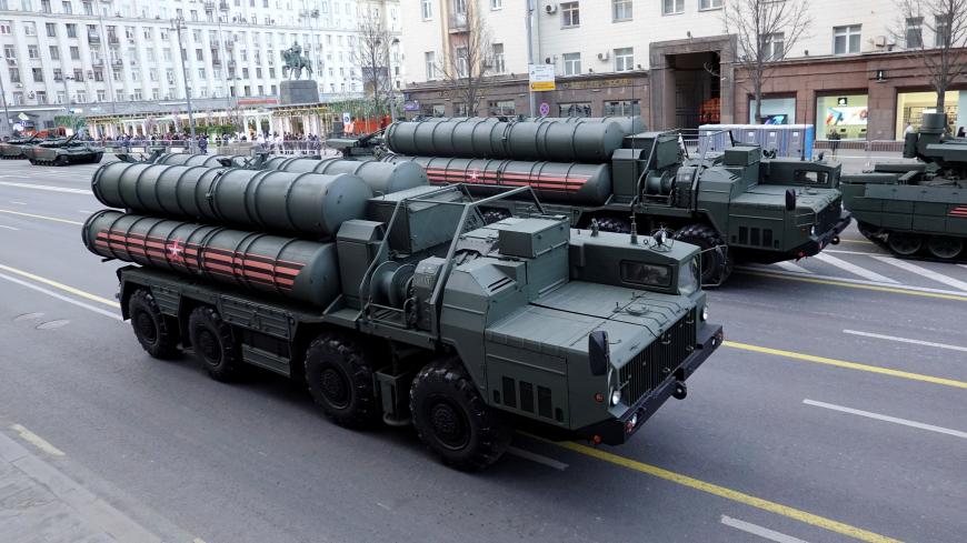 Russian servicemen sit in the cabins of S-400 missile air defence systems in Tverskaya Street before a rehearsal for the Victory Day parade, which marks the anniversary of the victory over Nazi Germany in World War Two, in central Moscow, Russia April 29, 2019. REUTERS/Tatyana Makeyeva - RC1E849FD530
