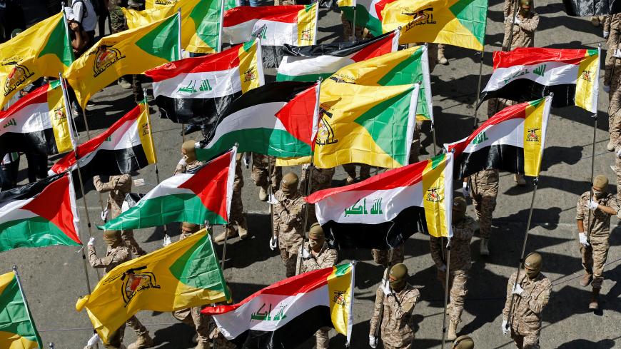 Iraqi Shi'ite Muslims march during a parade marking the annual al-Quds Day (Jerusalem Day) on the last Friday of the Muslim holy month of Ramadan in Baghdad, Iraq May 31, 2019. REUTERS/Thaier al-Sudani - RC1C93970790
