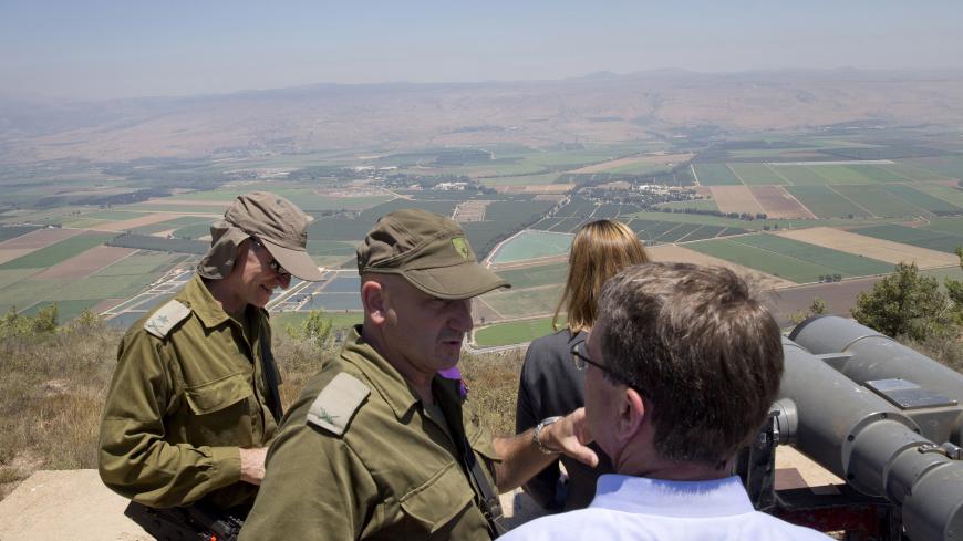 KIRYAT SHMONA, ISRAEL - JULY 20: U.S. Defense Secretary Ash Carter, lower right, talks with Israel Defense Forces (IDF) 91st Division Commander Moni Katz, center as Deputy Chief of Staff Maj. Gen. Yair Golan stands left, as they view the Hula Valley from the Hussein Lookout in northern Israel along the boarder with Lebanon July 20, 2015 near Kiryat Shmona, Israel. Carter said he has no expectation of persuading Israeli leaders to drop their opposition to the Iran nuclear deal, but will instead emphasize th
