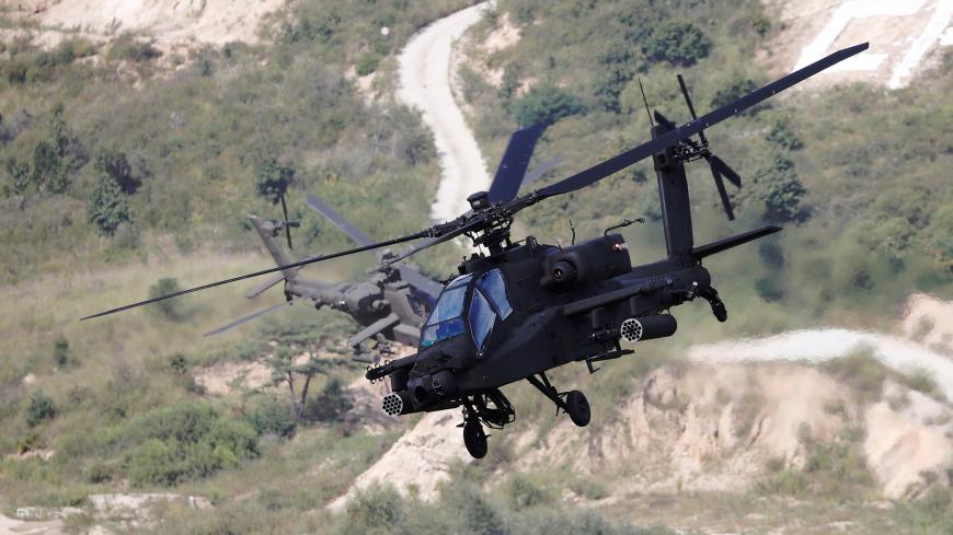 South Korean army Apache helicopters fly during a demonstration at a media event of 2018 Defense Expo Korea near the demilitarized zone separating the two Koreas in Pocheon, South Korea, September 11, 2018.    REUTERS/Kim Hong-Ji - RC14D5CD39F0