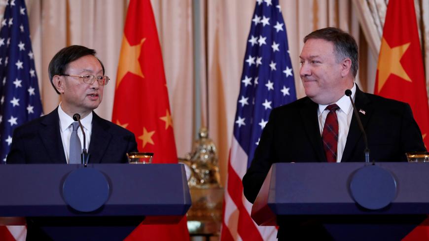 U.S. Secretary of State Mike Pompeo listens to Chinese Communist Party Office of Foreign Affairs Director Yang Jiechi speak as the two countries hold a joint news conference after participating in a second diplomatic and security meeting at the U.S. Department of State, Washington, U.S., November 9, 2018. REUTERS/Leah Millis - RC152C740580