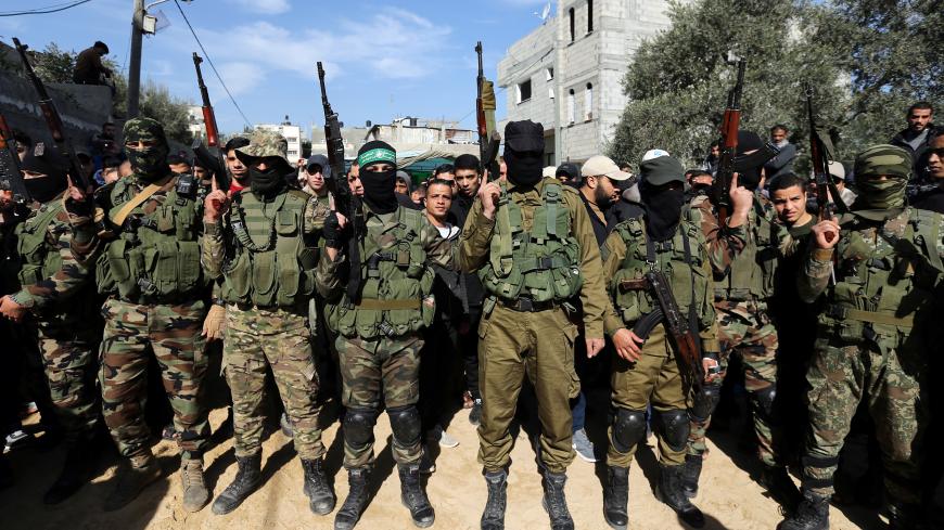 Palestinian Hamas militants take part in the funeral of their comrade Mahmoud Al-Nabaheen in the central Gaza Strip January 23, 2019. REUTERS/Ibraheem Abu Mustafa - RC1E6E9AAB00