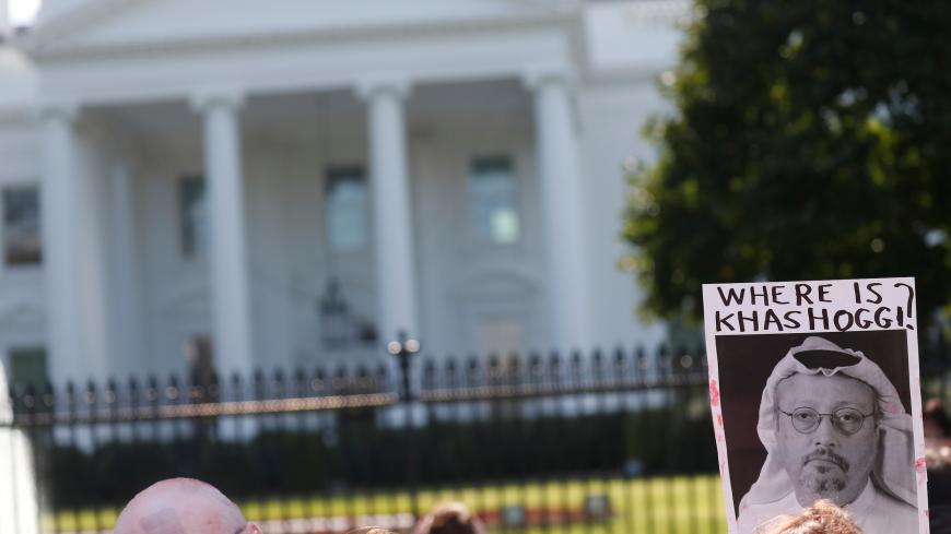 An activist holds an image of missing Saudi journalist Jamal Khashoggi during a demonstration calling for sanctions against Saudi Arabia and to protest Khashoggi's disappearance, outside the White House in Washington, U.S., October 19, 2018. REUTERS/Leah Millis - RC1F626030D0