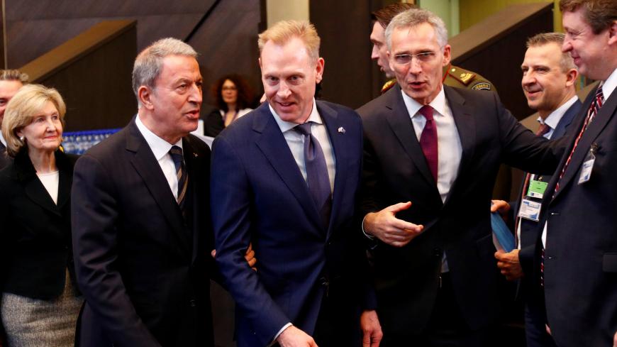 Turkey's Defence Minister Hulusi Akar, U.S. Secretary of Defense Patrick Shanahan and NATO Secretary General Jens Stoltenberg attend a NATO defence ministers meeting at the Alliance headquarters in Brussels, Belgium February 13, 2019.  REUTERS/Francois Lenoir - RC12887C8A40
