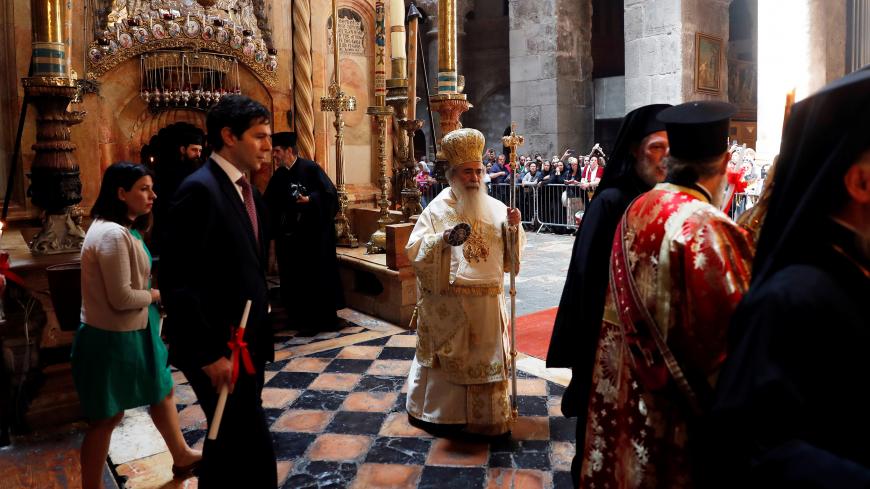 Greek Orthodox Patriarch of Jerusalem Metropolitan Theophilos leads Easter Sunday Mass at the Church of the Holy Sepulchre in Jerusalem's Old City April 28, 2019. REUTERS/Ronen Zvulun - RC136C91C440
