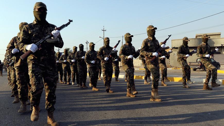 Members of Iraqi Popular Mobilization Forces (PMF) take part in a military parade in the town of Taza, south of the northern oil city of Kirkuk, Iraq June 28, 2019. REUTERS/Ako Rasheed - RC1A38BBA4F0