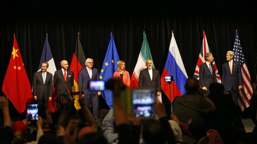 Chinese Foreign Minister Wang Yi, French Foreign Minister Laurent Fabius, German Foreign Minister Frank Walter Steinmeier, High Representative of the European Union for Foreign Affairs and Security Policy Federica Mogherini, Iranian Foreign Minister Mohammad Javad Zarif, British Foreign Secretary Philip Hammond and U.S. Secretary of State John Kerry (L-R) pose for a family picture after the last plenary session at the United Nations building in Vienna, Austria July 14, 2015. Iran and six major world powers 