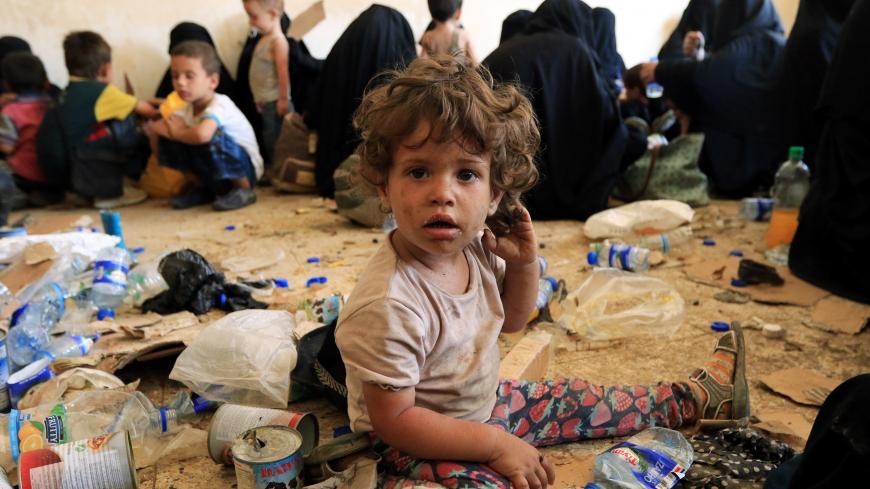 Children of families of Islamic State militants are see after they surrender themselves to the Kurdish Peshmerga forces in al-Ayadiya, northwest of Tal Afar, Iraq August 30, 2017. REUTERS/Ari Jalal - RC1E67598CF0