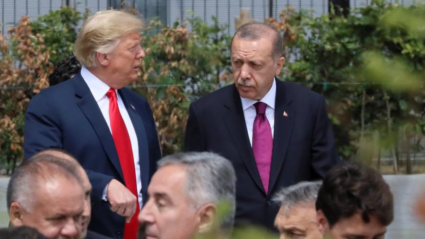 U.S. President Donald Trump, Turkish President Tayyip Erdogan and Canada's Prime Minister Justin Trudeau are seen at the start of the NATO summit in Brussels, Belgium July 11, 2018.   REUTERS/Reinhard Krause - RC1C67E741D0