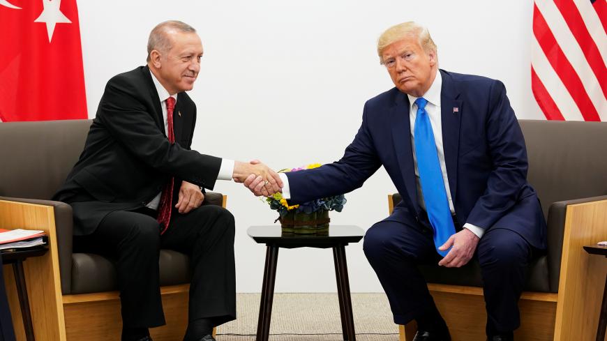 U.S. President Donald Trump shakes hands during a bilateral meeting with Turkey's President Tayyip Erdogan during the G20 leaders summit in Osaka, Japan, June 29, 2019. REUTERS/Kevin Lamarque - RC1DDD25D480