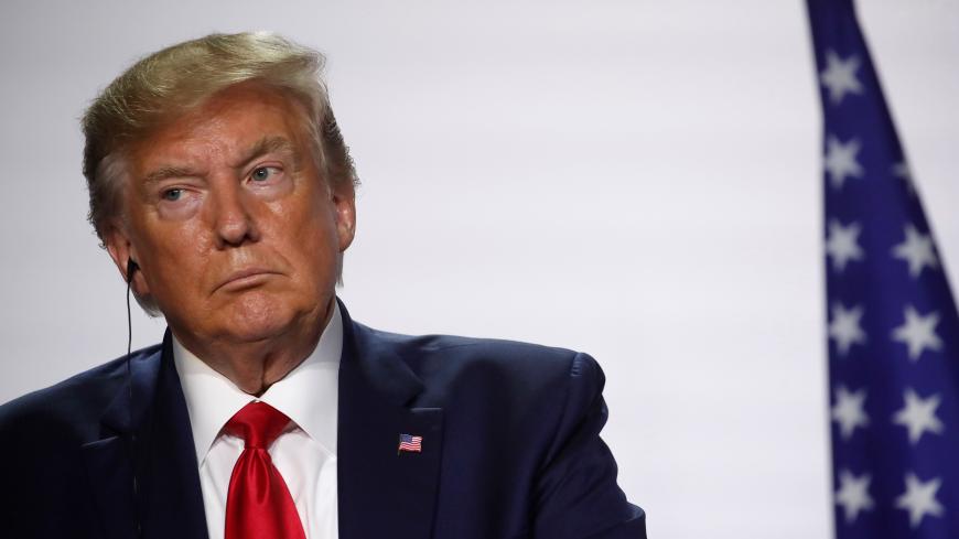 U.S. President Donald Trump attends a joint press conference with French President Emmanuel Macron (not seen) at the end of the G7 summit in Biarritz, France, August 26, 2019.  REUTERS/Christian Hartmann - RC149A0F16C0