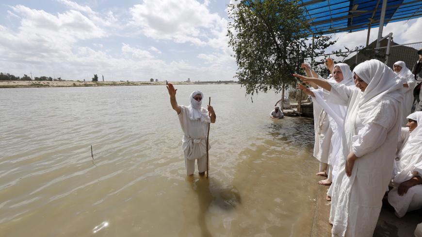Mandaeans perform religious rituals during the Benja festival along the Tigris river in Baghdad March 16, 2016. REUTERS/Ahmed Saad - GF10000347592