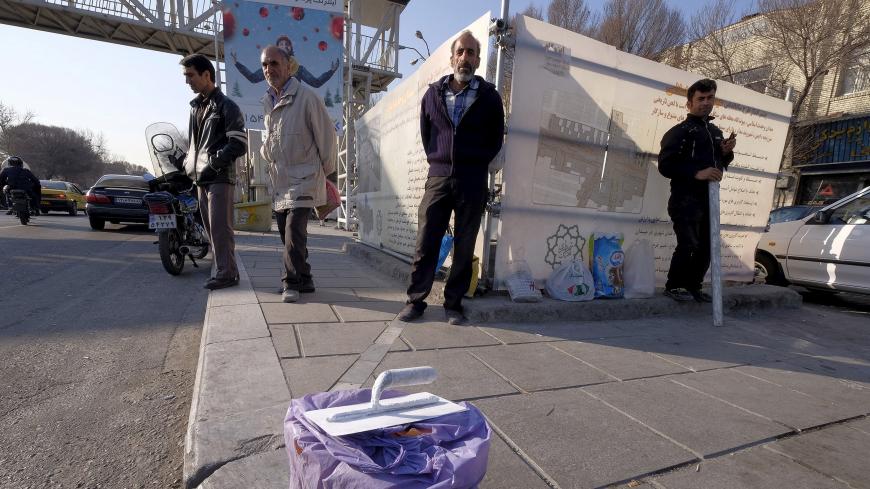 Unemployed labourers stand on a sidewalk as they wait for job offers, in Tehran, Iran January 20, 2016. REUTERS/Raheb Homavandi/TIMA  ATTENTION EDITORS - THIS IMAGE WAS PROVIDED BY A THIRD PARTY. FOR EDITORIAL USE ONLY.   - GF20000101001