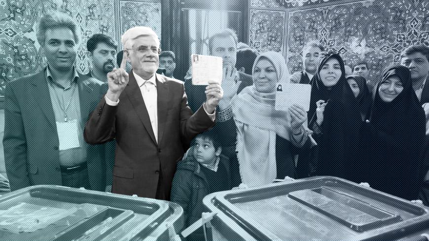 Iranian former vice president and candidate for parliamentary election Mohammad Reza Aref and his wife show their ink-stained fingers after casting their ballots during elections for the parliament and Assembly of Experts, which has the power to appoint and dismiss the supreme leader, in Tehran February 26, 2016.  REUTERS/Raheb Homavandi/TIMA  ATTENTION EDITORS - THIS IMAGE WAS PROVIDED BY A THIRD PARTY. FOR EDITORIAL USE ONLY. - GF10000324077