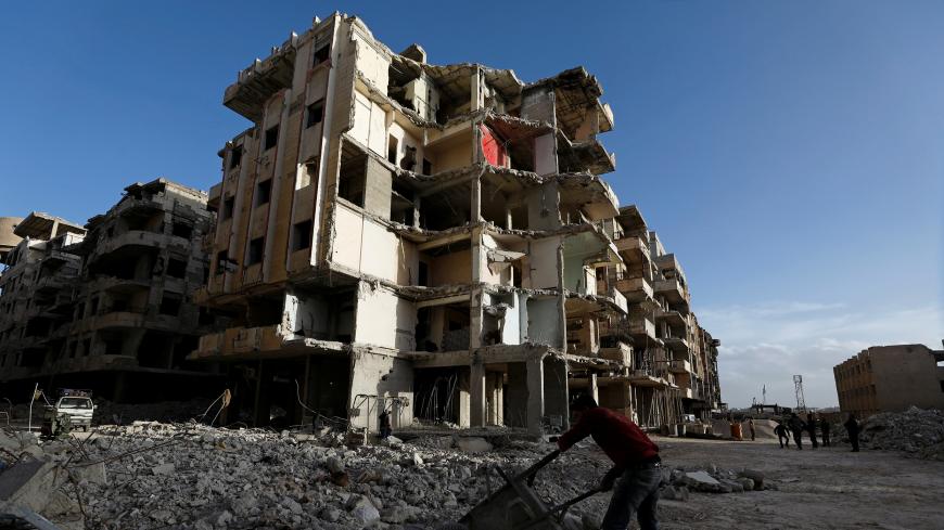 Workers work at a construction site in Ein Terma, a district of eastern Ghouta, Syria February 26, 2019. Picture taken February 26, 2019. REUTERS/Omar Sanadiki - RC18BEF25A70