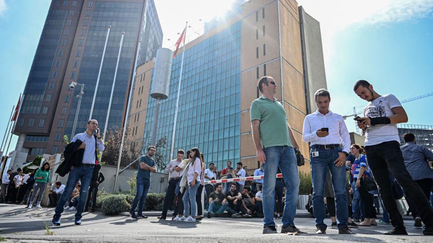 Office workers gather after fleeing their buildings in the Maslak District of Istanbul on September 26, 2019, following an earthquake in the city. - A 5.7-magnitude earthquake shook Turkey's largest city, driving residents to evacuate buildings, AFP journalists witnessed. (Photo by Ozan KOSE / AFP) (Photo credit should read OZAN KOSE/AFP/Getty Images)