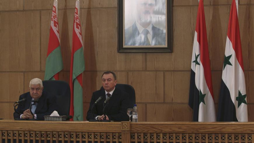 Syria's Foreign Minister Walid al-Moualem (R) and Belarus' Foreign Minister Vladimir Makei attend a news conference in Damascus February 9, 2015. Syria will not compromise on its sovereignty by allowing foreign troops on its soil to fight Islamic State militants, Walid al-Moualem said during a news conference on Monday. REUTERS/Omar Sanadiki (SYRIA - Tags: POLITICS CONFLICT) - GM1EB291NOL01