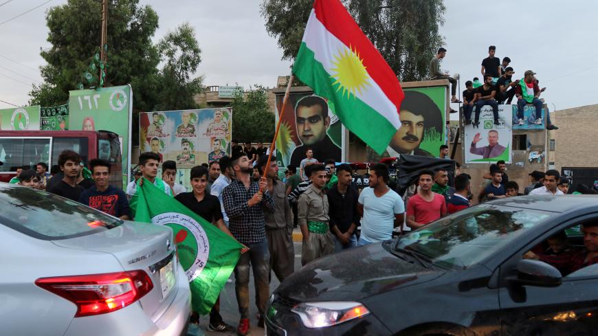 Kurdish supporters of the Patriotic Union of Kurdistan (PUK) celebrate after the closing of ballot boxes during the parliamentary election in Kirkuk, Iraq, May 12, 2018. REUTERS/Ako Rasheed - RC1D42ED63F0