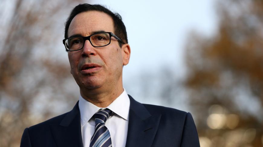 U.S. Treasury Secretary Steven Mnuchin speaks to the news media after giving a television interview at the White House in Washington, U.S. December 3, 2018. REUTERS/Leah Millis - RC1936F926B0