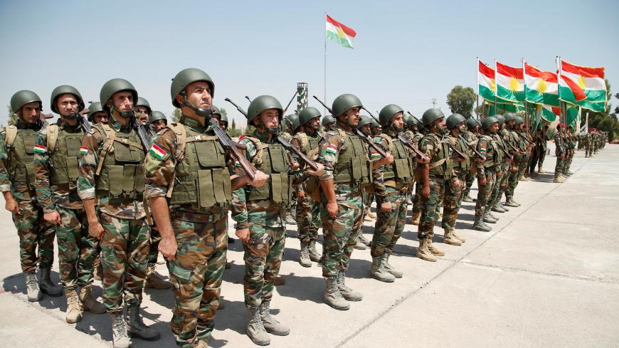 Kurdish Peshmerga Forces take part in their graduation ceremony at a military camp in Erbil, Iraq, August 21, 2019.  REUTERS/Azad Lashkari - RC1EEC7735A0