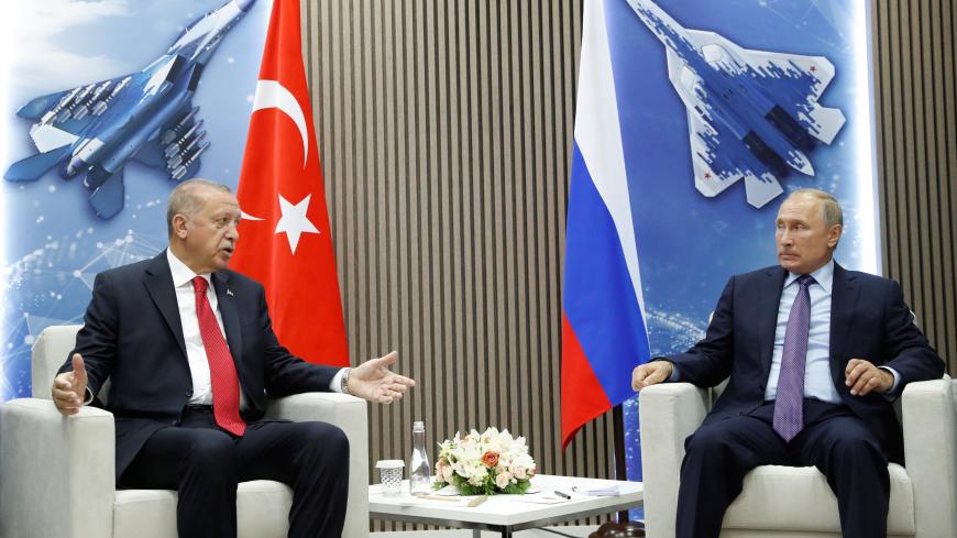 Russian President Vladimir Putin and Turkish President Recep Tayyip Erdogan speak during their meeting on the sidelines of the MAKS-2019 International Aviation and Space Salon in Zhukovsky outside Moscow, Russia, August  27, 2019. Maxim Shipenkov/Pool via REUTERS - RC147D99BA60