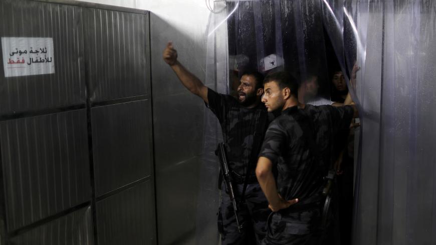Palestinian Hamas security forces stand guard at the hospital following an explosion in Gaza City August 27, 2019. REUTERS/Mohammed Salem     TPX IMAGES OF THE DAY - RC13666F2270