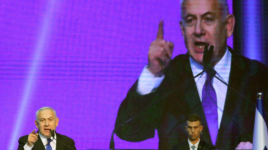 Israeli Prime Minister Benjamin Netanyahu gestures at the Likud party headquarters following the announcement of exit polls during Israel's parliamentary election in Tel Aviv, Israel September 18, 2019. REUTERS/Ammar Awad - RC13C6D573A0