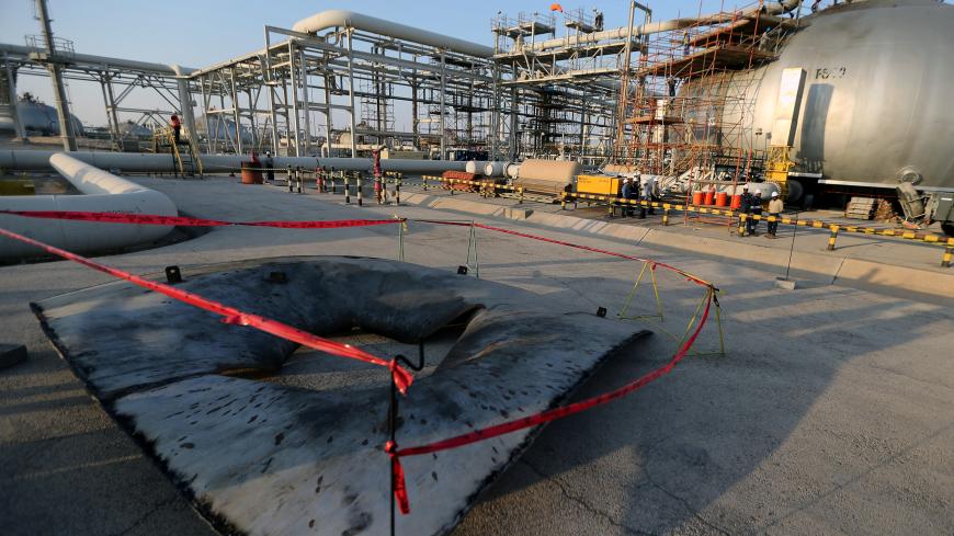 A metal part of a damaged tank is seen at the damaged site of Saudi Aramco oil facility in Abqaiq, Saudi Arabia, September 20, 2019. REUTERS/Hamad l Mohammed - RC1941E02750