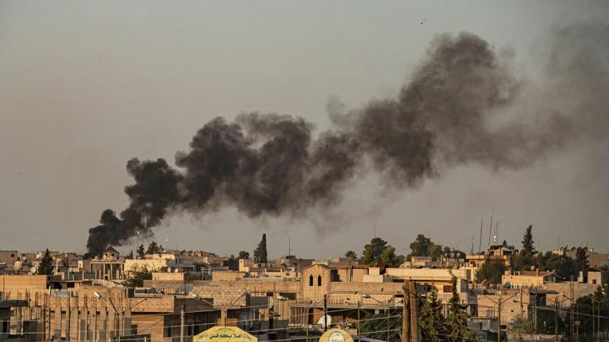 TOPSHOT - Smoke billows following Turkish bombardment on Syria's northeastern town of Ras al-Ain in the Hasakeh province along the Turkish border on October 9, 2019. - Turkey launched an assault on Kurdish forces in northern Syria with air strikes and explosions reported along the border. President Recep Tayyip Erdogan announced the start of the attack on Twitter, labelling it "Operation Peace Spring". (Photo by Delil SOULEIMAN / AFP) (Photo by DELIL SOULEIMAN/AFP via Getty Images)