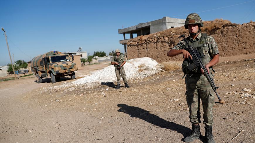 Turkish soldiers stand guard in a border village on the Turkish-Syrian border near Akcakale in Sanliurfa province, Turkey, September 8, 2019. REUTERS/Murad Sezer - RC17F8587730