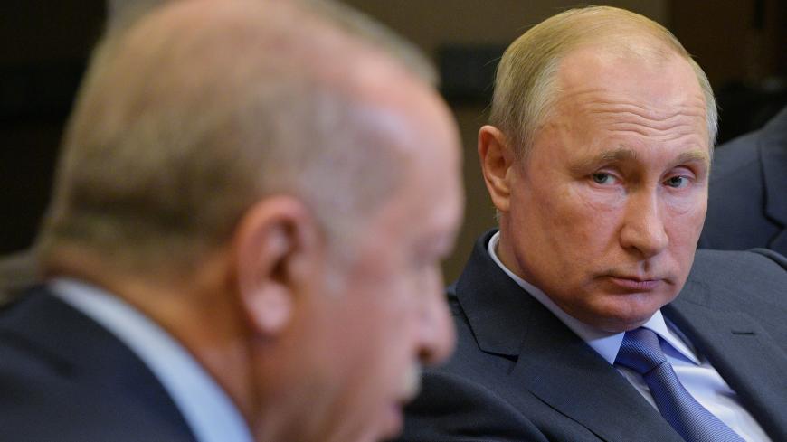 Russian President Vladimir Putin listens to Turkish President Tayyip Erdogan during a meeting in Sochi, Russia October 22, 2019. Sputnik/Alexei Druzhinin/Kremlin via REUTERS  ATTENTION EDITORS - THIS IMAGE WAS PROVIDED BY A THIRD PARTY. - RC1B16EB1DD0
