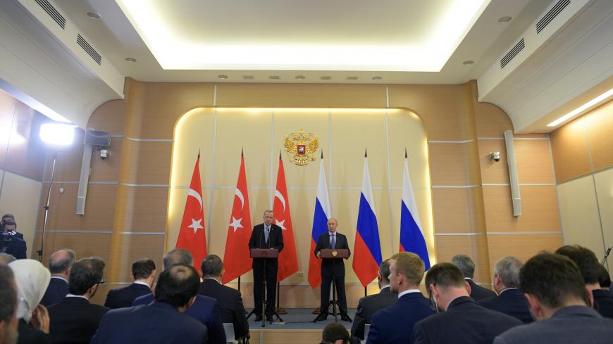 Russian President Vladimir Putin and Turkish President Tayyip Erdogan attend a news conference following their talks in Sochi, Russia October 22, 2019. Sputnik/Alexei Druzhinin/Kremlin via REUTERS ATTENTION EDITORS - THIS IMAGE WAS PROVIDED BY A THIRD PARTY. - RC1AC62B4210