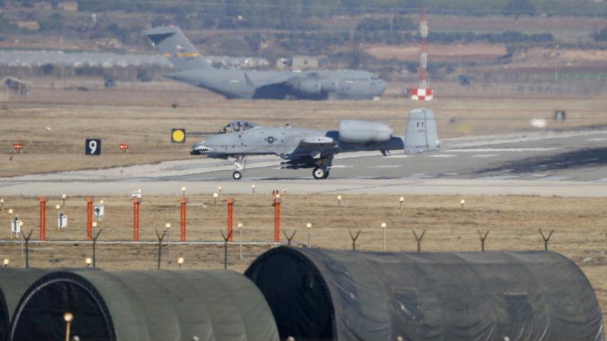 A U.S. Air Force A-10 Thunderbolt II fighter jet (foreground) lands at Incirlik airbase in the southern city of Adana, Turkey, December 11, 2015. REUTERS/Umit Bektas - GF10000262265