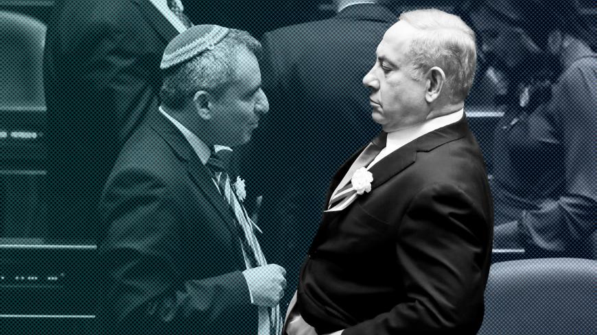 Israeli Prime Minister Benjamin Netanyahu speaks with member of the Knesset for Likud Zeev Elkin as they attend the swearing-in ceremony of the 22nd Knesset, the Israeli parliament, in Jerusalem October 3, 2019. REUTERS/Ronen Zvulun - RC1F058B5430